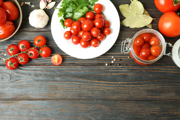 Concept of pickled vegetables with tomatoes on rustic wooden table