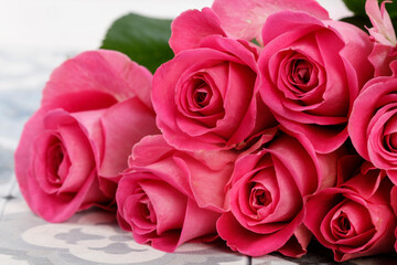 Pink roses on traditional portuguese floor tiles.