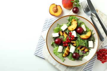 Concept of tasty food with salad with grilled peach, top view