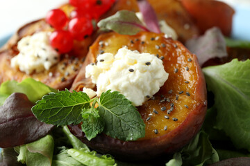 Salad with tasty grilled peach, close up