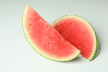 Two juicy watermelon slices on white background