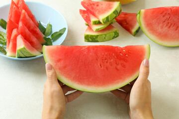 Female hands hold watermelon slice, close up
