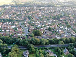 An aerial view of a typical suburban development of modern detached housing