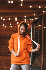 happy bright girl walks against the backdrop of glowing lanterns.