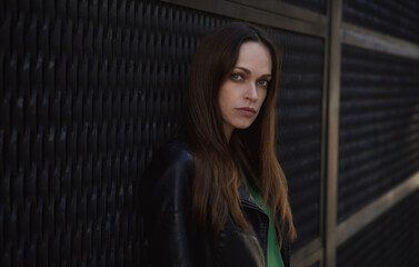 Pretty brunette woman in the city. Outdoors portrait