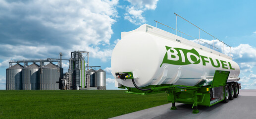 Tank with the inscription BIOFUEL on the background of silos. Bio fuel concept © scharfsinn86