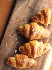 mini croissants on wooden board