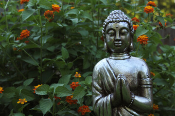 Buddha Statue in Garden with green background