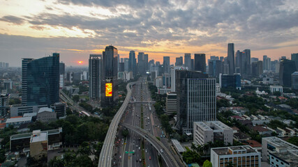 Aerial view of Panoramic photo of Jakarta overlooking Parklands, and the city skyline with a spectacular sunset. Jakarta, Indonesia, August 13, 2021