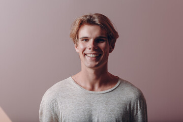 Fototapeta premium Portrait european young man portrait at studio in face mask