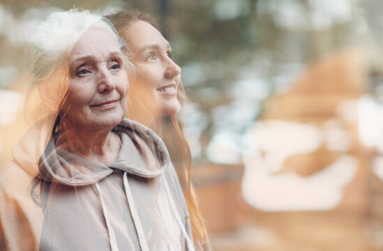 Grandmother and granddaughter women double exposure image. Young and elderly woman portrait. Love, dreams and happy family relations concept