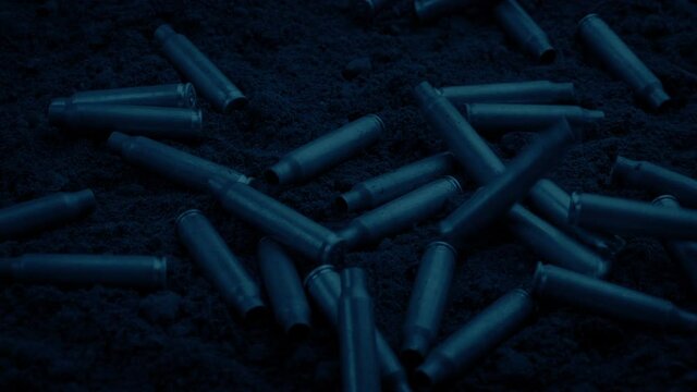 Bullet Cases Dropping In Muzzle Flashes In The Dark