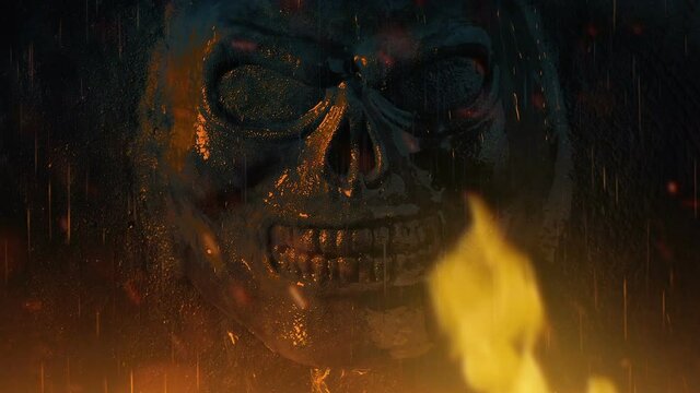 Fire Rages Near Skull Wall Carving In The Rain