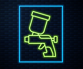 Glowing neon line Paint spray gun icon isolated on brick wall background. Vector