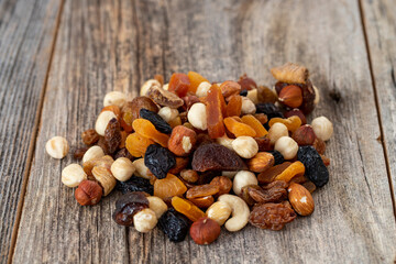 Mixed nuts on wood floor. Organic and fresh nuts. close up
