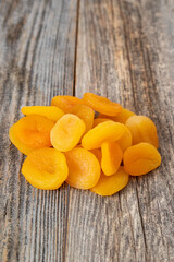 Dried apricots on wood floor. Organic and fresh nuts. close up