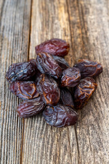 Date fruit on wood background. Organic and fresh nuts. close up