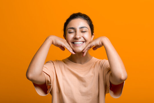 Close Up Portrait Of Young Indian American Woman Doing Facebuilding Yoga Face Gymnastics Yoga Self Massage