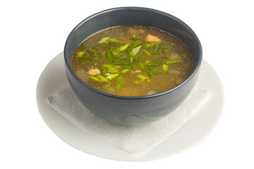dish soup with greens in a plate