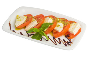 Tomatoes with cheese and mint on a plate