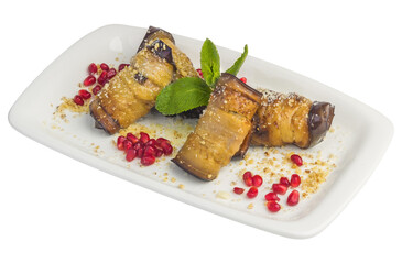 Stuffed eggplant with pomegranate on a plate
