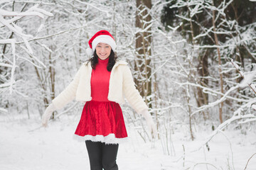 Beautiful girl in a snowy forest