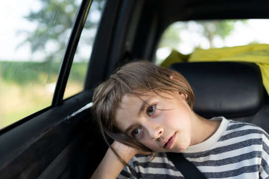 A young boy taking a car ride