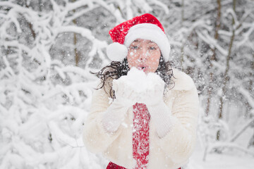Beautiful girl in a snowy forest