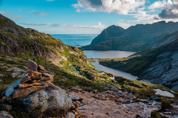 Fototapeta na wymiar Beautiful view of mountains and ocean on the trail to Munkeby hut, Lofoten, Norway