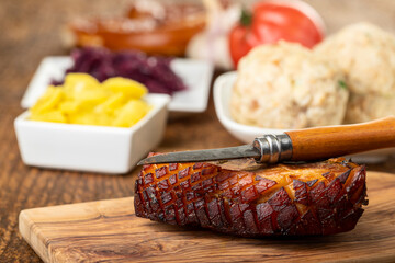portion of fresh roasted pork on a blue plate