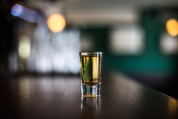 Shot glass on a bar counter