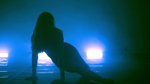 Girl is dancing a new style disco contemporary party solo dance with blue color smoke