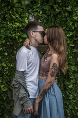 Portrait of millennial couple in love kissing. stylish picture. Wearing casual clothes. High quality photo 