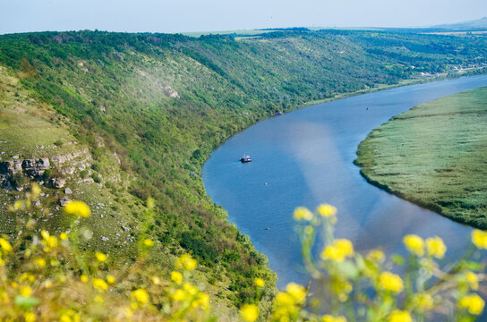 Landscape of Nistru River in Tipova, Moldova with stony hillside and vegetation