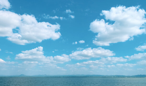 Scenic Clouds And Blue Sky Background. The Natural Beauty Of The Tropical Sea Landscape. Horizon Line Seascape.