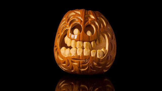 Intricately craved halloween pumpkin rots over several days.