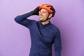 Young Brazilian cyclist man isolated on purple background smiling a lot - obrazy, fototapety, plakaty