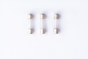 Fototapeta premium Radio components, old glass fuse on white background. Simple electronics
