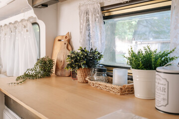 Interior of home, windowsill with flower, indoor camper van. © brizmaker
