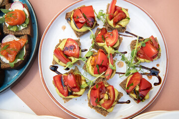 Food catering appetizers snacks on a tray on table.
