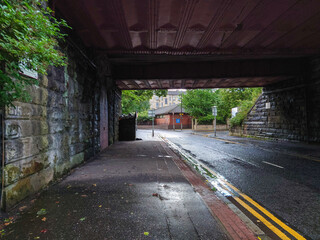 View of a city road from under a railway tunnel