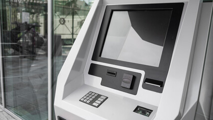 Close-up of a ticket vending machine with a blank black screen