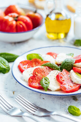 Mozzarella and tomato salad with basil, olive oil and ciabatta bread