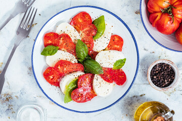 Mozzarella and tomato salad with basil, olive oil and ciabatta bread