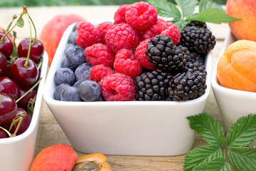 Berries in a bowl, healthy vegetarian food, fresh organic fruit