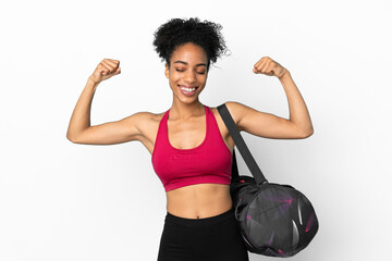 Fototapeta na wymiar Young sport african american woman with sport bag isolated on blue background doing strong gesture