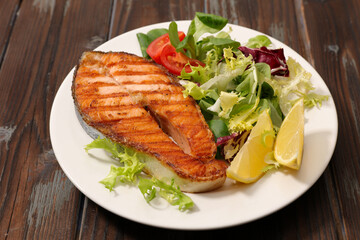 grilled salmon steak and lettuce