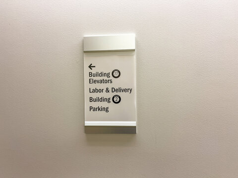 The Building Elevator, Labor And Delivery And Parking Sign For A Hospital.