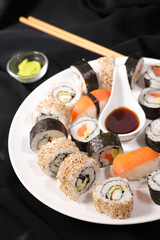 set of sushi and maki with soy sauce