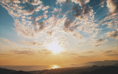 Sunset on dreamy sky with beautiful clouds representing summer and good vibes